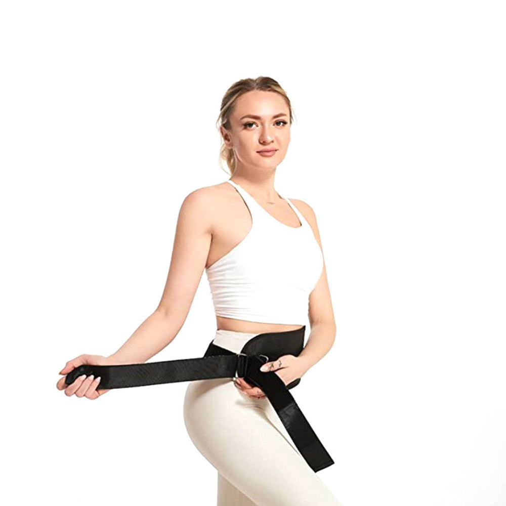 Woman wearing a black waist trainer on a white background